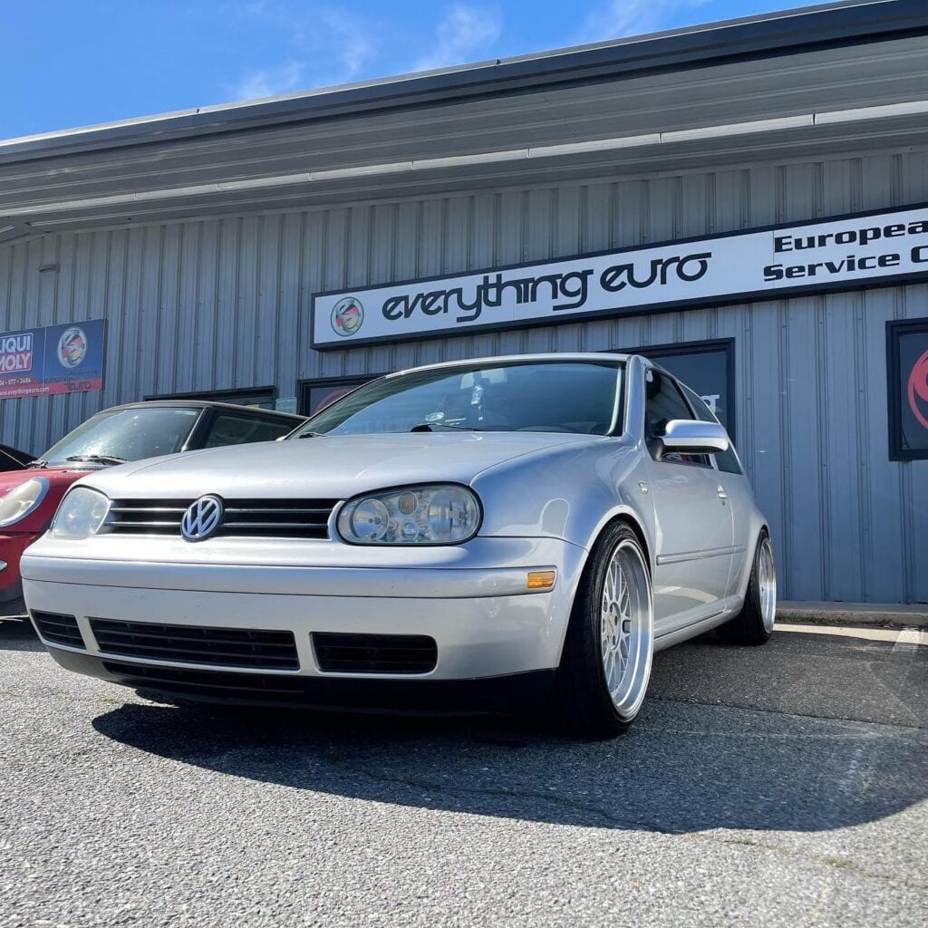 Silver Volkswagen Gti Euro Service Silver Volkswagen Golf Mk4 parked in front of "Everything Euro" European auto service shop.