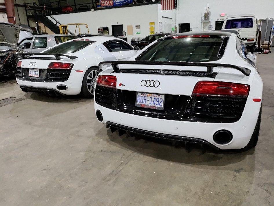 White Audi R8 sports cars at an Everything Euro Repair Shop.