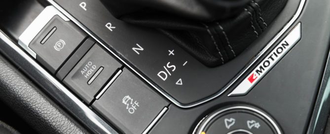 Close-up of a car's 4MOTION selector dial and automatic gear shifter