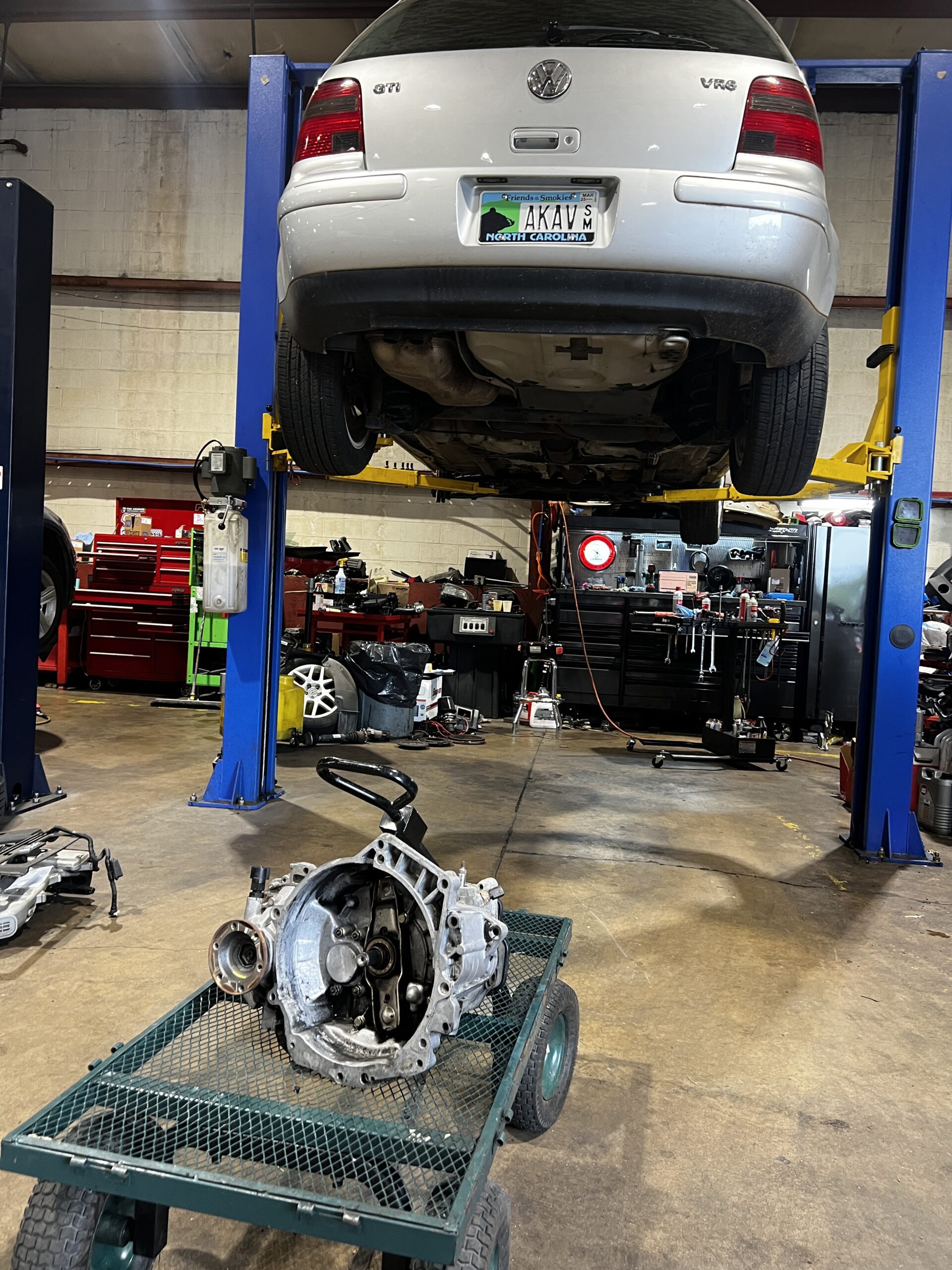 VW GTI transmission removed, car on lift at Euro repair shop